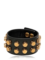 SAINT LAURENT - GROßES LEDERNES MANSCHETTENARMBAND MIT NIETEN - SCHWARZ/GOLD